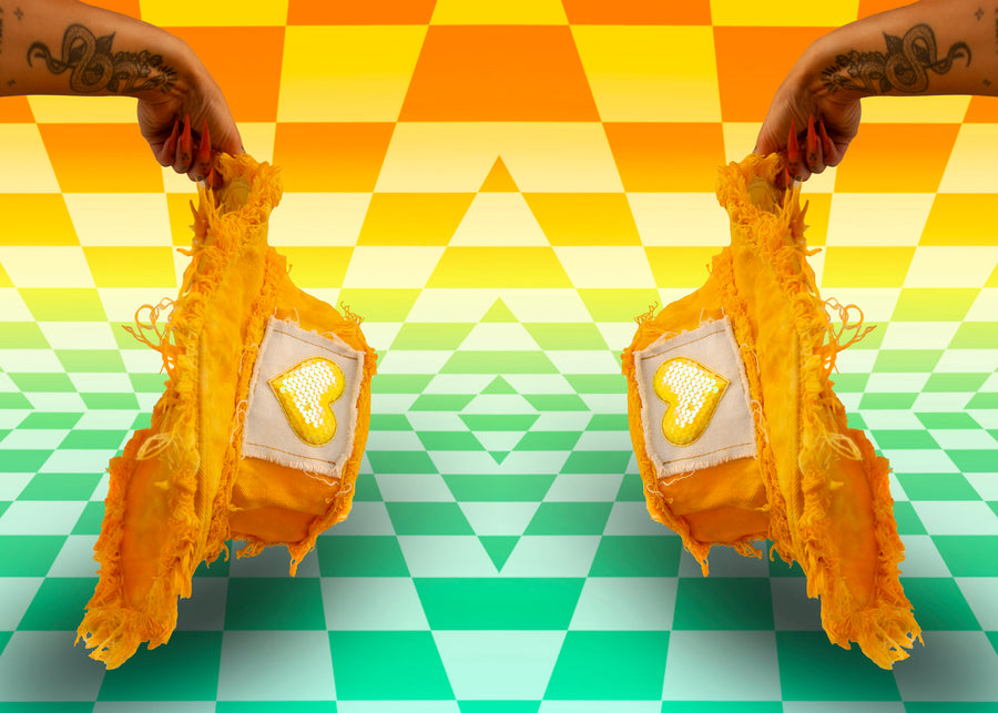 Hands Mirrored Holding Yellow Tie Dye Denim Bucket Hats with Heart Sequin Front Stash Pocket Velcro Patches and Frayed Edges | Y2K Neon Nomade Festival Rave EDC Burning Man Coachella Tomorrowland Fashion featuring Upcycled Coats, Hats, Jackets, Water Bottles, and Cute Keychain Accessories