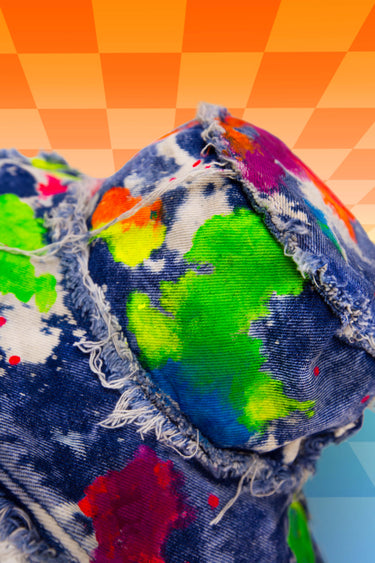 Rainbow Blacklight UV Glow Painted Artist Frayed Denim Bucket Hat Close Up View | Hand Painted Festival Rave Fashion | Neon Nomade