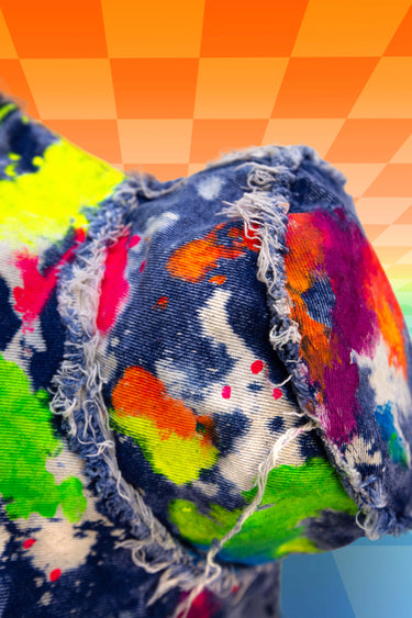 Rainbow Blacklight UV Glow Painted Artist Frayed Denim Bucket Hat Close Up View | Hand Painted Festival Rave Fashion | Neon Nomade
