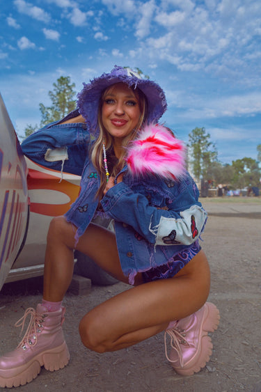 Model in Purple Butterfly Tie Dye Denim Bucket Hat and matching Crop Jacket with Pink Faux Fur Collar | Handmade Festival Fashion | Neon Nomade & Alyssa Risley