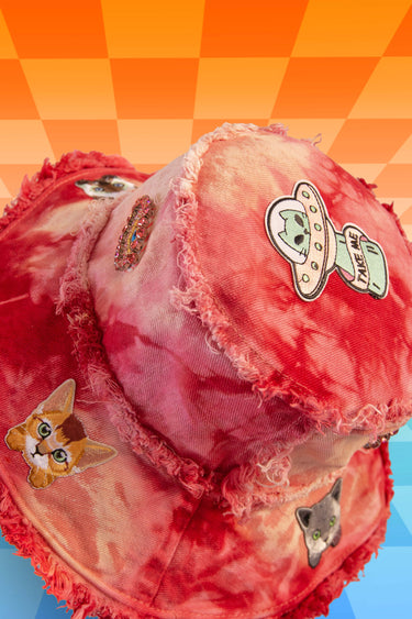 Top View of Red and Pink Tie Die Bucket Hat with UFO Cat and Third Eye Jewel Patches and Frayed Distressed Edges | Festival Fairy Rave EDC Burning Man Fashion | Neon Nomade