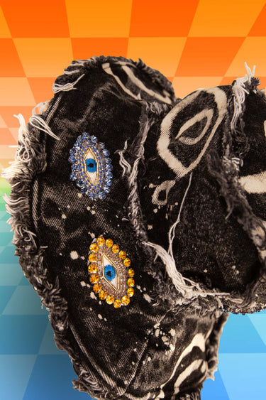 Top View of Crying Rain Eyes Evil Eye Hand Painted Bleach Dye Black Denim Bucket Hat with Distressed Frayed Edges | Festival Fashion Rave Goth Steampunk Witchcore Witchy Diamond Jewel Eye Patches | Wearable Art by Neon Nomade