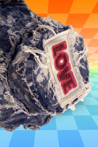 Top View of Splatter Bleach Denim Bucket Hat with Front Stash Pocket and Sequin Top Love Patch and Frayed Edges | Handmade Upcycled Festival Rave Fashion | Neon Nomade