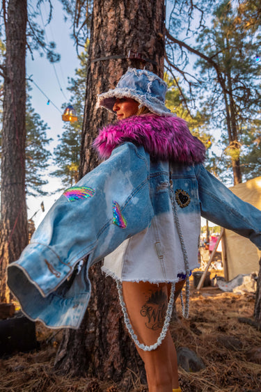 Mixtape Custom Oversized Denim Cropped Jacket with Love Sequin Cassettes and Heart Patches and Oversized 70's Style Pink Faux Fur Collar and Removable Hanging Denim Chain Straps | Festival Girly Rave Retro Style Fashion | Neon Nomade worn by Alyssa Risley in the forest at Desert Hearts