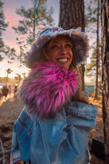 Smiling Model Portrait in Denim Bucket Hat and Custom Oversized Denim Jacket with Pink Faux Fur Collar | Mixtape Jacket | Festival Fashion | Neon Nomade