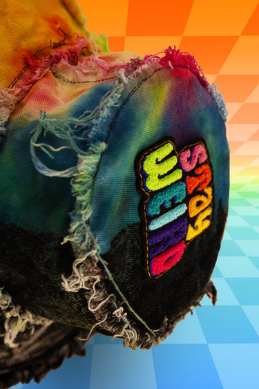 Stay Weird Top View of Half and Half Reverse Dye Rainbow Tie Dye Black Denim Bucket Hat with Hot Pink Heart Sequin Patch Pocket and Frayed Distressed Edges | Handmade Festival Rave Goth Witch Witchcore Fashion | Neon Nomade